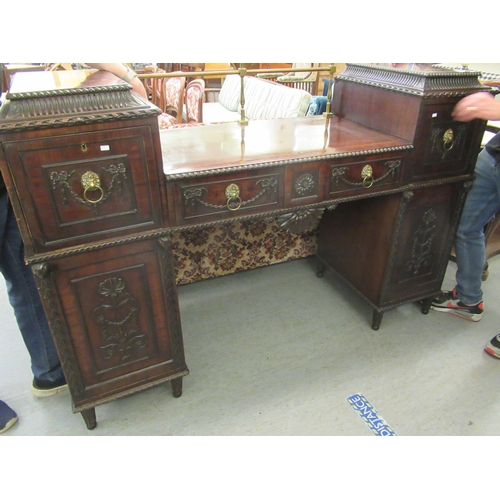 252 - A William IV mahogany drop well sideboard, the two pillars containing a drawer and cellarette drawer... 