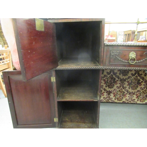 252 - A William IV mahogany drop well sideboard, the two pillars containing a drawer and cellarette drawer... 