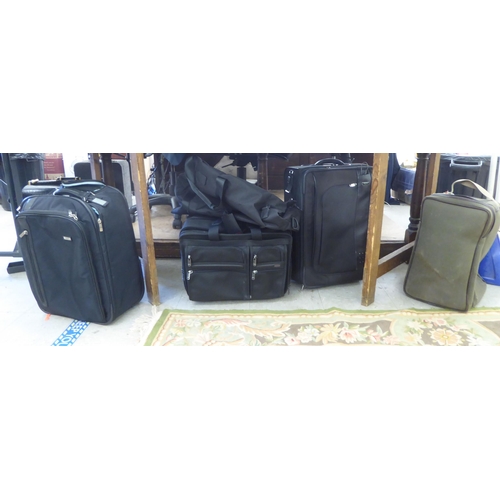 344 - Tumi luggage: to include a black canvas cabin bag; and a William & Son canvas bag 