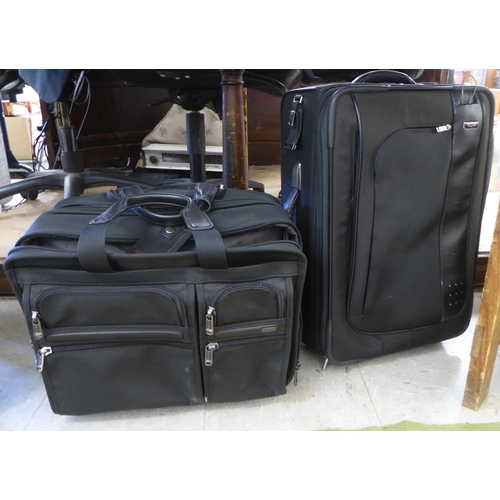 344 - Tumi luggage: to include a black canvas cabin bag; and a William & Son canvas bag 