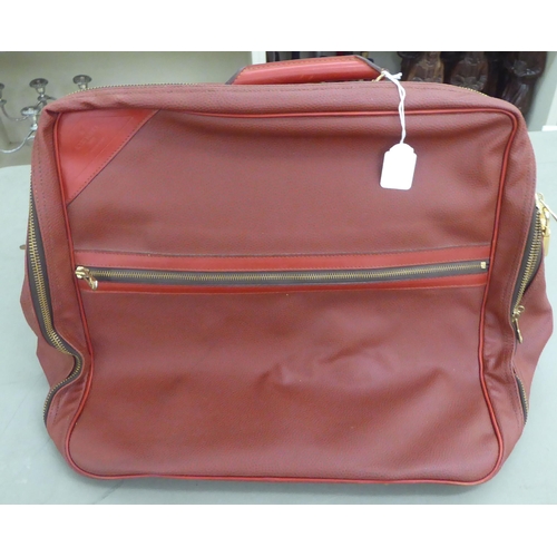 375 - A Louis Vuitton Challenge Line Z red leather holdall 