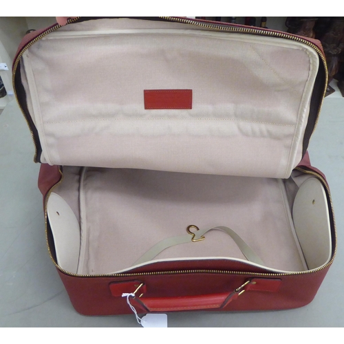 375 - A Louis Vuitton Challenge Line Z red leather holdall 