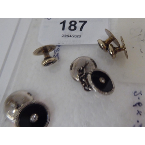 187 - A pair of 9ct white gold cufflinks, each set with a white stone and three matching shirt studs