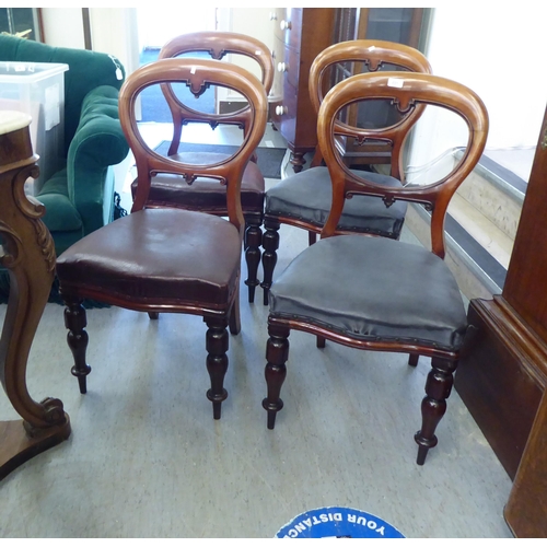 231 - A set of four late Victorian mahogany framed balloon back dining chairs with blue faux hide upholste... 