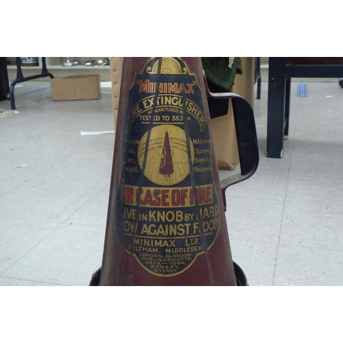 278 - A vintage Minimax cone shaped fire extinguisher, on an associated wrought iron stand 