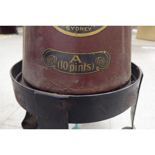 278 - A vintage Minimax cone shaped fire extinguisher, on an associated wrought iron stand 