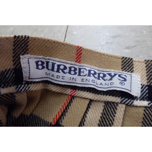 303 - Burberry and similar clothing: to include a three-quarter length raincoat