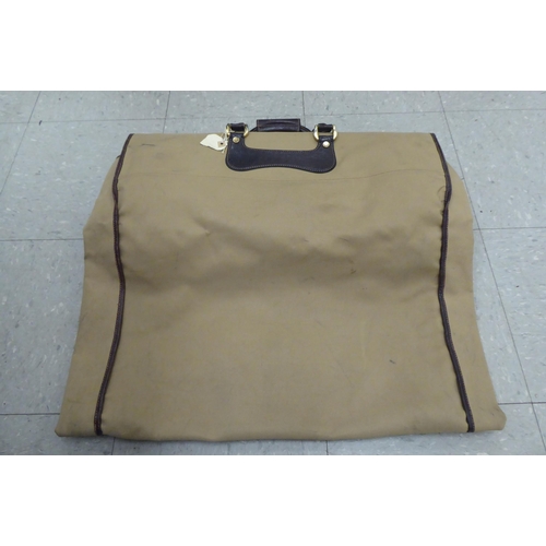 322 - A Gucci brown fabric suit carrying case 