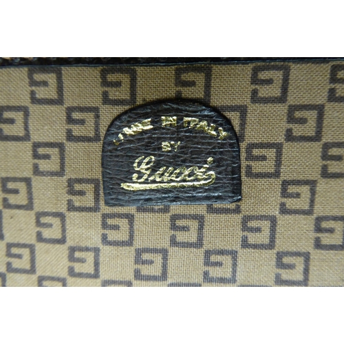 322 - A Gucci brown fabric suit carrying case 