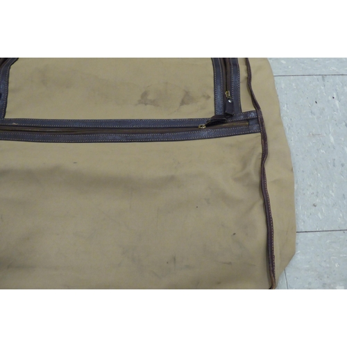 322 - A Gucci brown fabric suit carrying case 