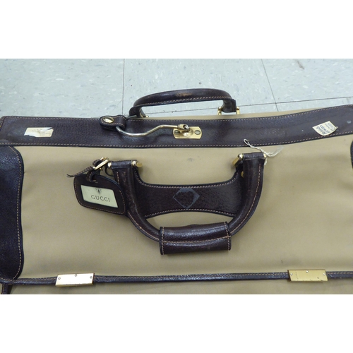 322 - A Gucci brown fabric suit carrying case 