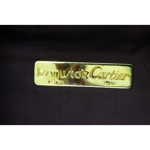 347 - A Cartier red leather garment carrier 