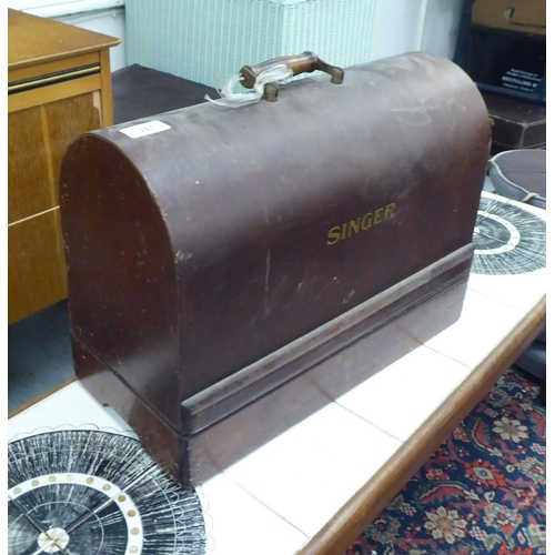 357 - A Singer sewing machine, in a walnut finished case 