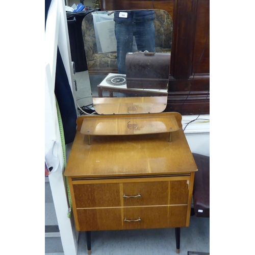 360 - Small furniture: to include a 1960s/70s light oak two drawer dressing table, raised on turned legs  ... 