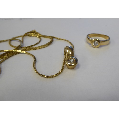 259 - A 15ct gold band ring, rubover set with a cubic zirconia; and a matching pendant, on a fine box link... 