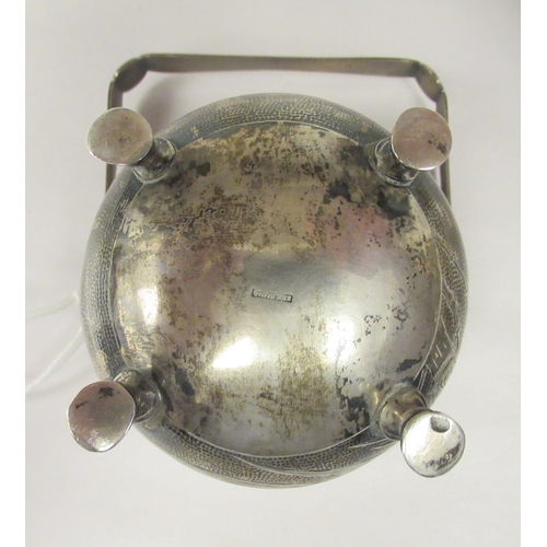 17 - A 1920s Chinese Zee Sung silver engraved sugar basin of cauldron form with a flared rim and swing ha... 