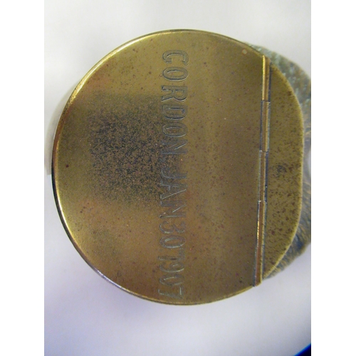 22 - An Edwardian cast brass mounted horse's hoof inkwell with a hinged cap, inscribed 'Cordon Jan 30 190... 