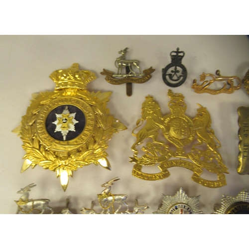 25 - Approx. thirty-two military cap badges and other insignia, some copies: to include the 4th Cheshire ... 