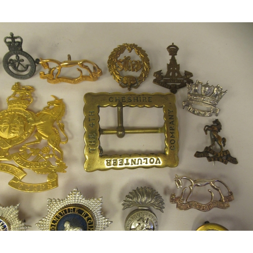 25 - Approx. thirty-two military cap badges and other insignia, some copies: to include the 4th Cheshire ... 