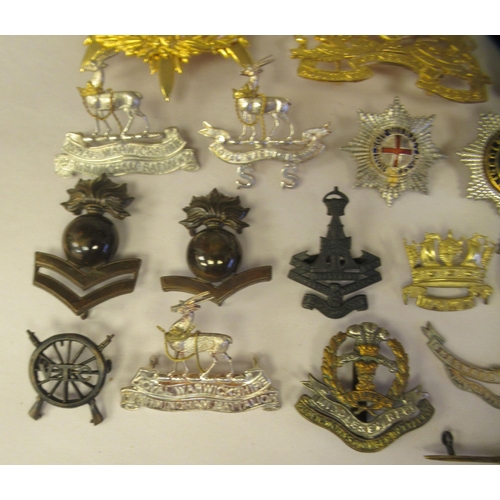 25 - Approx. thirty-two military cap badges and other insignia, some copies: to include the 4th Cheshire ... 