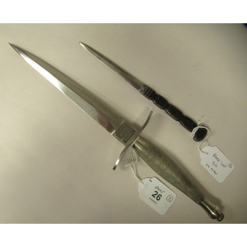 26 - An FS fighting knife with a textured hilt, the Wilkinson blade 6.75