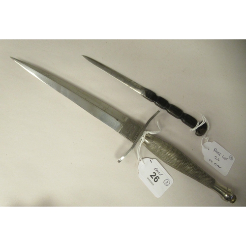 26 - An FS fighting knife with a textured hilt, the Wilkinson blade 6.75