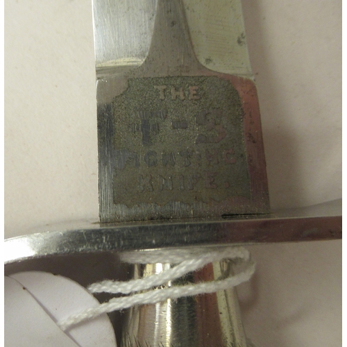 26 - An FS fighting knife with a textured hilt, the Wilkinson blade 6.75