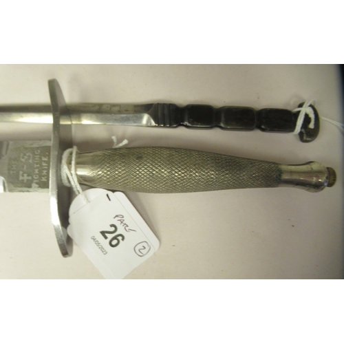 26 - An FS fighting knife with a textured hilt, the Wilkinson blade 6.75