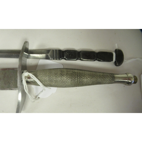 26 - An FS fighting knife with a textured hilt, the Wilkinson blade 6.75