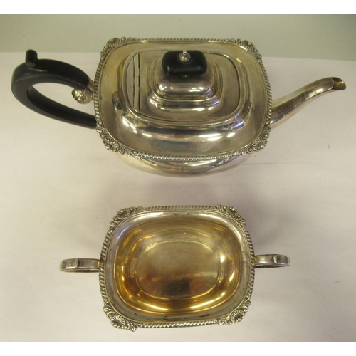 3 - A silver teapot of oval, bulbous form with dragooned and shell cast decoration, a swept spout, insul... 