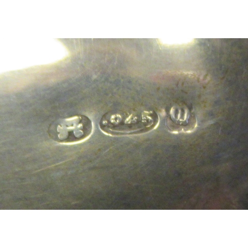 3 - A silver teapot of oval, bulbous form with dragooned and shell cast decoration, a swept spout, insul... 