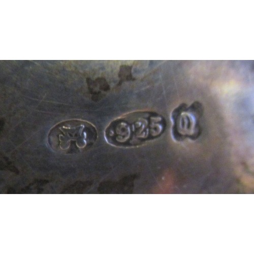 3 - A silver teapot of oval, bulbous form with dragooned and shell cast decoration, a swept spout, insul... 