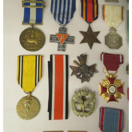 32 - Various 20thC British and foreign medals, medallions and ribbons, some copies: to include a German I... 