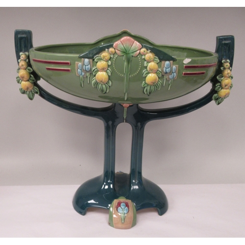 37 - An Art Deco two tone blue/green glazed pottery table centrepiece oval bowl, elevated on a twin pedes... 