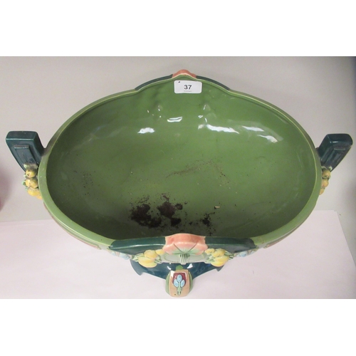 37 - An Art Deco two tone blue/green glazed pottery table centrepiece oval bowl, elevated on a twin pedes... 