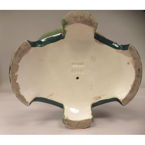 37 - An Art Deco two tone blue/green glazed pottery table centrepiece oval bowl, elevated on a twin pedes... 