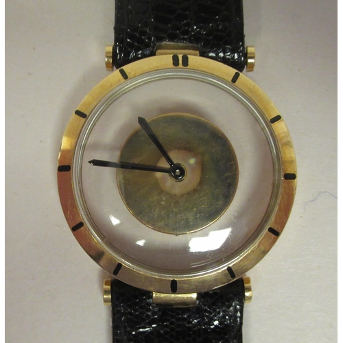 38 - A Jaeger LeCoultre 18ct gold cased Mystery wristwatch, stamped A566948, faced by a baton dial on the... 