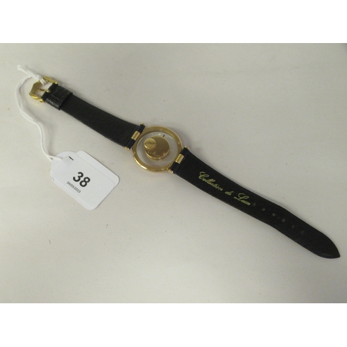 38 - A Jaeger LeCoultre 18ct gold cased Mystery wristwatch, stamped A566948, faced by a baton dial on the... 