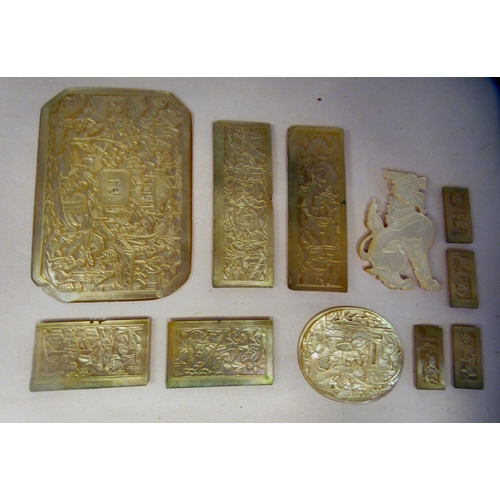 51 - Chinese relief carved mother-of-pearl objects: to include rectangular gaming counters; and an elonga... 