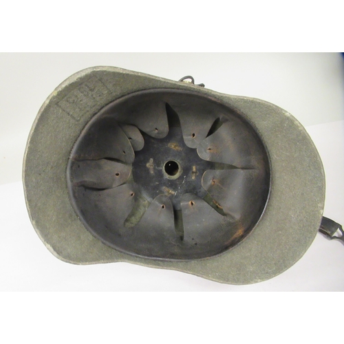 57 - A Great War period German moulded khaki coloured felt pickelhaube with a hide liner and chinstrap(Pl... 