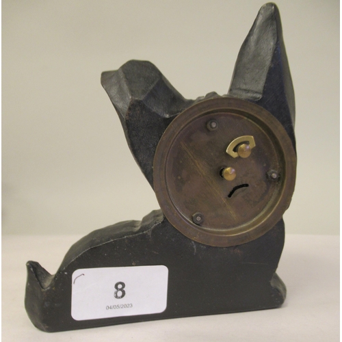 8 - An Art Deco German Oswald Rolling Eye clockwork, novelty timepiece, in a black painted cast iron cas... 