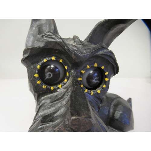 8 - An Art Deco German Oswald Rolling Eye clockwork, novelty timepiece, in a black painted cast iron cas... 