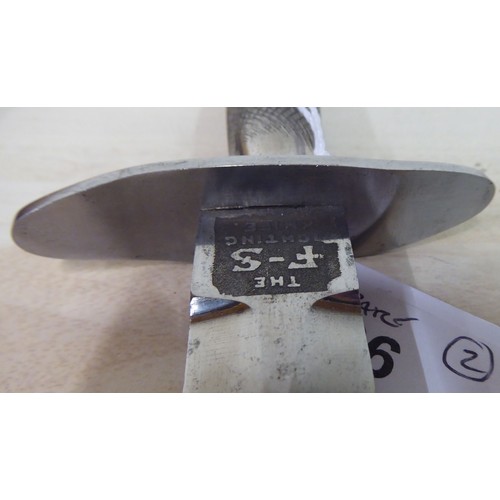 26 - An FS fighting knife with a textured hilt, the Wilkinson blade 6.75