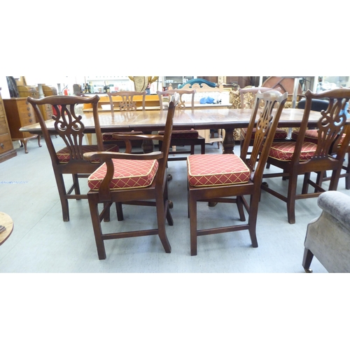 165 - A modern reproduction of a Georgian oak twin pedestal dining table, the top with a moulded edge and ... 