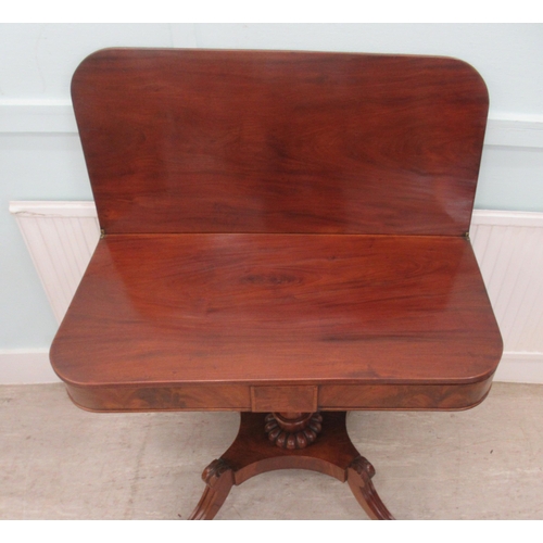 107 - A Regency mahogany tea table with a foldover top, raised on splayed, sabre legs and casters  29