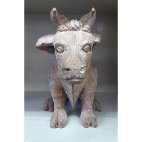 127 - A carved wooden papier mache cow mould  13.5