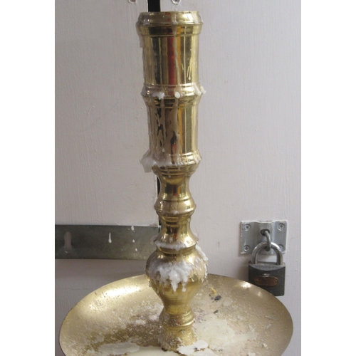 17 - A pair of 20thC ecclesiastical brass candlesticks with spun columns, on circular bases  51