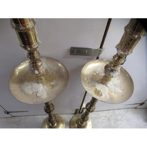 17 - A pair of 20thC ecclesiastical brass candlesticks with spun columns, on circular bases  51