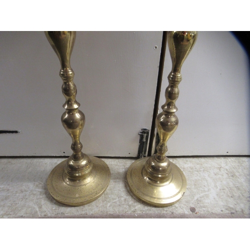 17 - A pair of 20thC ecclesiastical brass candlesticks with spun columns, on circular bases  51