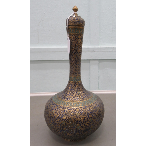 184 - A 20thC Middle Eastern enamelled and brass vase with a tall neck and bulbous body, on a pedestal foo... 